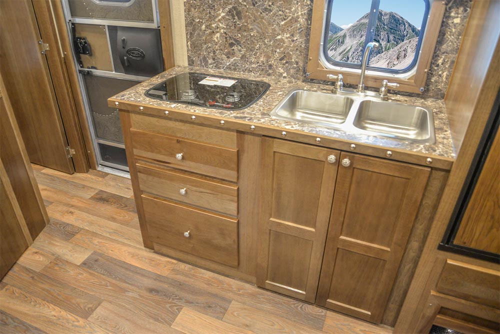 Sink in Kitchen Area in Living Quarters in SLE8X15SBB Laramie Edition Livestock Trailer | SMC Trailers