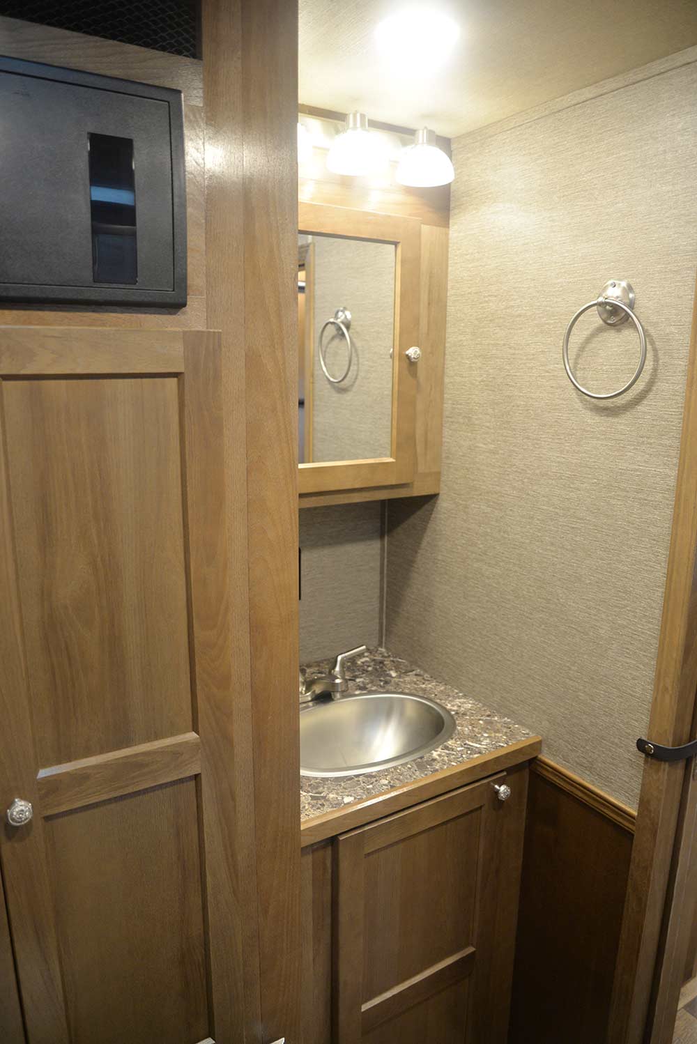 Sink in Bathroom in SLTH8X14SSR Laramie Edition Toy Hauler | SMC Trailers