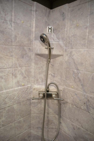Shower in Bathroom in SL8X18SBBSRB Laramie Edition Horse Trailer | SMC Trailers